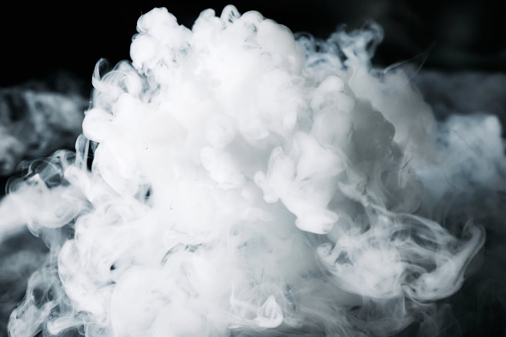 A dense, artistic smoke cloud captured with dramatic lighting, creating a mysterious effect.